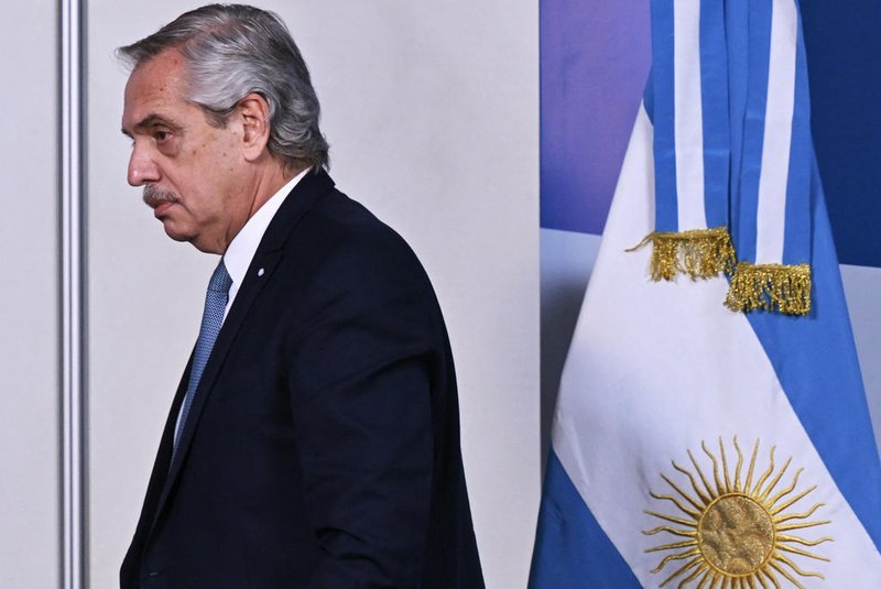 (FILES) Argentine President Alberto Fernandez arrives to a press conference in the framework of the Summit of Heads of State of MERCOSUR and Associated States in Puerto Iguazu, Argentina on July 4, 2023. Argentina's former President Alberto Fernandez was charged on February 29, 2024 with alleged embezzlement for the irregular contracting of private insurance for public employees, according to the local press and the judge in the case. (Photo by NELSON ALMEIDA / AFP)<!-- NICAID(15693633) -->