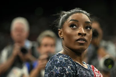 US' Simone Biles is seen during the artistic gymnastics women's team final during the Paris 2024 Olympic Games at the Bercy Arena in Paris, on July 30, 2024. (Photo by Lionel BONAVENTURE / AFP)<!-- NICAID(15828607) -->
