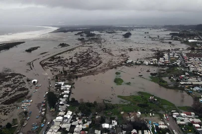 This aerial view shows a flooded area in the coastal city of Arauco, BioBio region, province of Arauco, Chile on July 16, 2026, following strong storms hitting the region. (Photo by GUILLERMO SALGADO / AFP)<!-- NICAID(16328761) -->