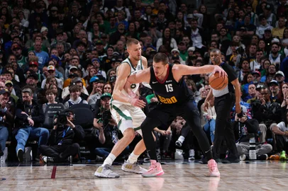 DENVER, CO - MARCH 7: Nikola Jokic #15 of the Denver Nuggets dribbles the ball during the game against the Boston Celtics on March 7, 2024 at the Ball Arena in Denver, Colorado. NOTE TO USER: User expressly acknowledges and agrees that, by downloading and/or using this Photograph, user is consenting to the terms and conditions of the Getty Images License Agreement. Mandatory Copyright Notice: Copyright 2024 NBAE   Garrett Ellwood/NBAE via Getty Images/AFP (Photo by Garrett Ellwood / NBAE / Getty Images / Getty Images via AFP)<!-- NICAID(15700180) -->