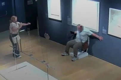 A video grab taken from a CCTV footage released by Palazzo Maffei museum on June 16, 2025 shows two tourists breaking a crystal-covered chair displayed as they are taking pictures at Palazzo Maffei museum in Verona and then fleeing once the damage became apparent. The Van Gogh chair by artist Nicola Bolla was described by the Palazzo Maffei museum as extremely fragile and covered in a myriad of Swarovski crystal. The footage showed the chair buckling under the weight of a male tourist who appeared to stubble backwards onto the chair as he was posing for a photo. The museum said it was initially concerned that it would not be possible to restore the chair, but great efforts by restorers meant that the piece is shining once again. (Photo by Handout / Palazzo Maffei museum / AFP) / RESTRICTED TO EDITORIAL USE - MANDATORY CREDIT "AFP PHOTO /  Palazzo Maffei museum" - HANDOUT - NO MARKETING NO ADVERTISING CAMPAIGNS - DISTRIBUTED AS A SERVICE TO CLIENTS<!-- NICAID(16060371) -->