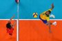 Brazil's Wallace de Souza (R) spikes the ball in the men's quarter-final volleyball match between Japan and Brazil during the Tokyo 2020 Olympic Games at Ariake Arena in Tokyo on August 3, 2021. (Photo by Antonin THUILLIER / AFP)<!-- NICAID(14852165) -->