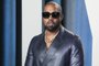(FILES) In this file photo Kanye West attends the 2020 Vanity Fair Oscar Party following the 92nd annual Oscars at The Wallis Annenberg Center for the Performing Arts in Beverly Hills on February 9, 2020. - Entertainment mogul Kanye West on June 30, 2020 released a new song, "Wash Us In the Blood," along with an accompanying video including imagery from recent anti-racism protests. The new track, the first released from the born-again rapper's planned 10th album "God's Country," features lyrics with heavily biblical overtones, in line with his musical turn to Christianity in recent years. (Photo by Jean-Baptiste Lacroix / AFP)<!-- NICAID(14538337) -->