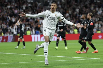 Real Madrid's French forward #09 Kylian Mbappe celebrates after converting a penalty to score their first goal during the Spanish league football match between Real Madrid CF and Club Deportivo Leganes SAD at the Santiago Bernabeu stadium in Madrid on March 29, 2025. (Photo by Thomas COEX / AFP)<!-- NICAID(16006184) -->