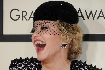 (FILES) In this file photo taken on February 8, 2015 Seven-time Grammy winner Madonna arrives on the red carpet for the 57th Annual Grammy Awards in Los Angeles. Madonna is recovering after falling ill with a "serious bacterial infection" that landed her in an intensive care unit for several days, her manager Guy Oseary said in a statement posted to social media on June 28."Her health is improving, however she is still under medical care," he said. "A full recovery is expected."Oseary said the pop icon's "Celebrations" tour, due to start July 15 in Vancouver, was postponed until further notice. (Photo by Valerie MACON / AFP)Editoria: ACELocal: Los AngelesIndexador: VALERIE MACONSecao: celebrityFonte: AFPFotógrafo: STF<!-- NICAID(15469144) -->