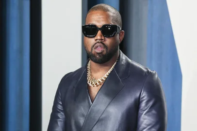 (FILES) In this file photo Kanye West attends the 2020 Vanity Fair Oscar Party following the 92nd annual Oscars at The Wallis Annenberg Center for the Performing Arts in Beverly Hills on February 9, 2020. - Entertainment mogul Kanye West on June 30, 2020 released a new song, "Wash Us In the Blood," along with an accompanying video including imagery from recent anti-racism protests. The new track, the first released from the born-again rapper's planned 10th album "God's Country," features lyrics with heavily biblical overtones, in line with his musical turn to Christianity in recent years. (Photo by Jean-Baptiste Lacroix / AFP)<!-- NICAID(14538337) -->