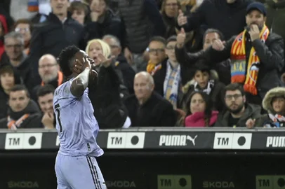 Real Madrid's Brazilian forward #07 Vinicius Junior reacts after scoring his team's second goal during the Spanish league football match between Valencia CF and Real Madrid at the Mestalla stadium in Valencia on March 2, 2024 (Photo by JOSE JORDAN / AFP) Real Madrid's Brazilian forward #07 Vinicius Junior celebrates scoring his team's first goal during the Spanish league football match between Valencia CF and Real Madrid at the Mestalla stadium in Valencia on March 2, 2024 (Photo by Jose Jordan / AFP)<!-- NICAID(15695168) -->
