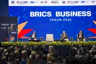 Malaysia's Prime Minister Anwar Ibrahim (L) speaks next to the president of the Brazilian Industry Conference, Ricardo Alban (2-L), Brazil's President Luiz Inacio Lula da Silva (3-L), and Brazil's Vice President and Minister of Industry and Trade Geraldo Alckmin during the BRICS Business Forum in Rio de Janeiro, Brazil, on July 5, 2025. BRICS leaders meeting in Rio de Janeiro from Sunday are expected to decry Donald Trump's hardline trade policies, but are struggling to bridge divides over crises roiling the Middle East. (Photo by Daniel RAMALHO / AFP)<!-- NICAID(16074119) -->