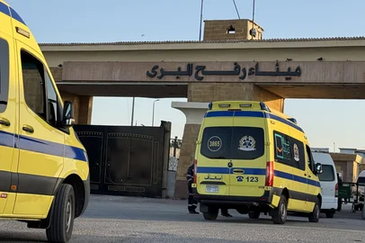 Ambulances wait in line at the Egyptian side of the Rafah border crossing with the Palestinian Gaza Strip, in northeastern Egypt on the first day of the evacuation of some 50 Palestinian, at the Rafah crossing on February 2, 2026. Gaza's key Rafah border crossing was reopened to Palestinians on February 2, 2026, an Israeli security official said, but Egyptian state-linked media said only 50 people would be allowed to cross in each direction in the early days. The resumption of operations comes after Israeli forces seized control of the gateway to Egypt in May 2024 during the war with Hamas. (Photo by AFP)<!-- NICAID(16217016) -->