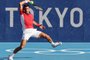 Serbia's Novak Djokovic returns the ball to Spain's Alejandro Davidovich Fokina during their Tokyo 2020 Olympic Games men's singles third round tennis match at the Ariake Tennis Park in Tokyo on July 28, 2021. (Photo by Giuseppe CACACE / AFP)<!-- NICAID(14846701) -->