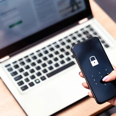 Phone password lock for mobile cyber security or login verification passcode in online bank app. Data privacy and protection from hacker, identity thief or cybersecurity threat. Laptop and smartphone.Fonte: 419339060<!-- NICAID(15441288) -->