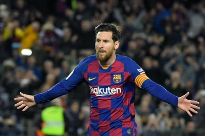 (FILES) In this file photo taken on March 07, 2020, Barcelona's Argentine forward Lionel Messi celebrates after scoring a goal during the Spanish league football match between FC Barcelona and Real Sociedad at the Camp Nou stadium in Barcelona, Spain. - Lionel Messi said on September 4, 2020 that he will stay at Barcelona, insisting he could never go to court against "the club of his life". (Photo by LLUIS GENE / AFP)<!-- NICAID(14584804) -->