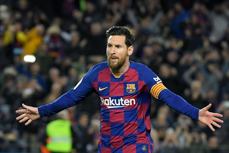 (FILES) In this file photo taken on March 07, 2020, Barcelona's Argentine forward Lionel Messi celebrates after scoring a goal during the Spanish league football match between FC Barcelona and Real Sociedad at the Camp Nou stadium in Barcelona, Spain. - Lionel Messi said on September 4, 2020 that he will stay at Barcelona, insisting he could never go to court against "the club of his life". (Photo by LLUIS GENE / AFP)<!-- NICAID(14584804) -->