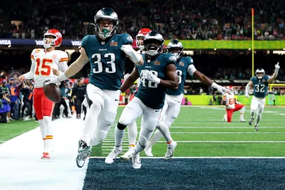 NEW ORLEANS, LOUISIANA - FEBRUARY 09: Cooper DeJean #33 of the Philadelphia Eagles celebrates scoring a touchdown after making an interception in the second quarter against the Kansas City Chiefs during Super Bowl LIX at Caesars Superdome on February 09, 2025 in New Orleans, Louisiana.   Gregory Shamus/Getty Images/AFP (Photo by Gregory Shamus / GETTY IMAGES NORTH AMERICA / Getty Images via AFP)<!-- NICAID(15972670) -->