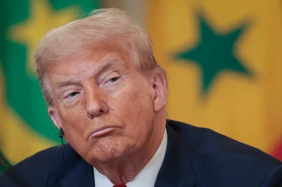 WASHINGTON, DC - JULY 09: U.S. President Donald Trump listens as African Leaders deliver remarks during a multilateral lunch in the State Dining Room of the White House July 9, 2025 in Washington, DC. The leaders of Gabon, Guinea-Bissau, Liberia, Mauritania and Senegal met with Trump during the luncheon.   Win McNamee/Getty Images/AFP (Photo by WIN MCNAMEE / GETTY IMAGES NORTH AMERICA / Getty Images via AFP)<!-- NICAID(16076897) -->