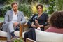 This undated image released March 7, 2021 courtesy of Harpo Productions shows Britain's Prince Harry (L) and his wife Meghan (C), Duchess of Sussex, in a conversation with US television host Oprah Winfrey. - Britain's royal family on March 7, 2021 braced for further revelations from Prince Harry and his American wife, Meghan, as a week of transatlantic claim and counter-claim reaches a climax with the broadcast of their interview with Oprah Winfrey. The two-hour interview with the US TV queen is the biggest royal tell-all since Harry's mother princess Diana detailed her crumbling marriage to his father Prince Charles in 1995. (Photo by Joe PUGLIESE / HARPO PRODUCTIONS / AFP) / RESTRICTED TO EDITORIAL USE - MANDATORY CREDIT "AFP PHOTO/ HARPO PRODUCTIONS -  Joe PUGLIESE" - NO MARKETING NO ADVERTISING CAMPAIGNS - DISTRIBUTED AS A SERVICE TO CLIENTS --- NO ARCHIVE ---<!-- NICAID(14729886) -->