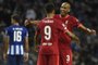 Liverpool's Brazilian forward Roberto Firmino celebrates with Liverpool's Brazilian midfielder Fabinho scoring his team's fifth goal during the UEFA Champions League first round group B footbal match between Porto and Liverpool at the Dragao stadium in Porto on September 28, 2021. (Photo by MIGUEL RIOPA / AFP)Editoria: SPOLocal: PortoIndexador: MIGUEL RIOPASecao: soccerFonte: AFPFotógrafo: STR<!-- NICAID(14901489) -->