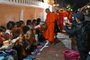 (FILES) Buddhist monks line up at dawn to receive food and alms from devotees in front of a pagoda in Luang Prabang on January 28, 2024. As dawn broke over Luang Prabang, saffron-robed monks trod the streets receiving alms -- but a cacophonous influx of camera-clutching tourists shattered the peace of the ancient Laotian town. (Photo by TANG CHHIN SOTHY / AFP)Editoria: RELLocal: Luang PrabangIndexador: TANG CHHIN SOTHYSecao: buddhismFonte: AFPFotógrafo: STF<!-- NICAID(15673186) -->