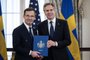 US Secretary of State Antony Blinken receives the NATO ratification documents from Swedish Prime Minister Ulf Kristersson during a ceremony at the US State Department, as Sweden formally joins the North Atlantic alliance, in Washington, DC, on March 7, 2024. Kristersson hailed his country's entry into NATO as a "victory for freedom," as it turned the page on two centuries of non-alignment following Russia's invasion of Ukraine. The accession "is a victory for freedom today. Sweden has made a free, democratic, sovereign and united choice to join NATO," he said at the ceremony. (Photo by ANDREW CABALLERO-REYNOLDS / AFP)<!-- NICAID(15699576) -->
