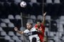Paraguay's Olimpia Isidro Pitta (L) and Brazil's Internacional Paulo Victor vie for the ball during their Copa Libertadores round of 16 first leg football match at the Manuel Ferreira stadium in Asuncion, on July 15, 2021. (Photo by Nathalia AGUILAR / various sources / AFP)Editoria: SPOLocal: AsuncionIndexador: NATHALIA AGUILARSecao: soccerFonte: AFPFotógrafo: STR<!-- NICAID(14836540) -->