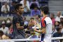 NEW YORK, NEW YORK - SEPTEMBER 07: (L-R) Felix Auger-Aliassime of Canada and Carlos Alcaraz of Spain meet at center court after Alcaraz retired early during the second set of their Mens Singles quarterfinals match on Day Nine of the 2021 US Open at the USTA Billie Jean King National Tennis Center on September 07, 2021 in the Flushing neighborhood of the Queens borough of New York City.   Matthew Stockman/Getty Images/AFP (Photo by MATTHEW STOCKMAN / GETTY IMAGES NORTH AMERICA / Getty Images via AFP)<!-- NICAID(14883733) -->