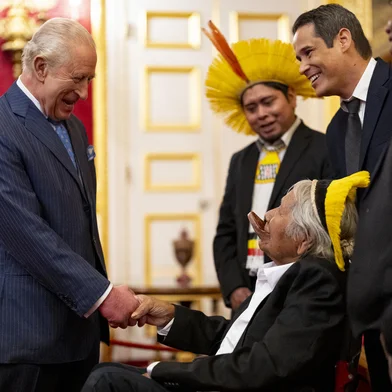 Britain's King Charles III (L) greets Kayapo Chief Raoni Metuktire, indigenous Brazilian leader and environmentalist, during a reception for scientists and business and indigenous leaders with the Circular Bioeconomy Alliance at St James's Palacein London on October 15, 2025. (Photo by Aaron Chown / POOL / AFP)<!-- NICAID(16147595) -->
