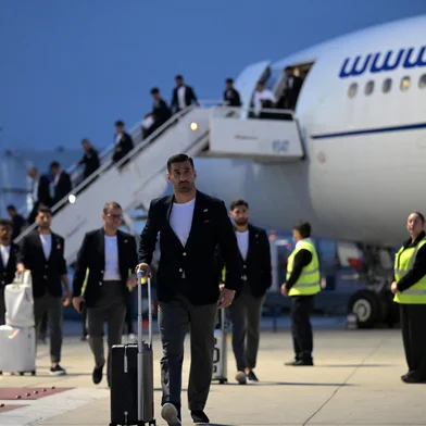 Iran's captain and defender Ehsan Hajsafi and teammates walk on the tarmac on arrival at the Tijuana International Airport in Tijuana, Mexico on June 7, 2026, ahead of the FIFA 2026 World Cup football tournament. (Photo by Guillermo Arias / AFP)<!-- NICAID(16301674) -->
