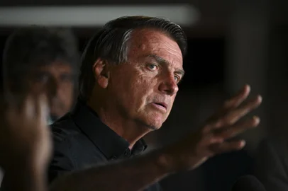 Brazilian President and re-election candidate Jair Bolsonaro speaks after learning the results of the legislative and presidential election in Brasilia, on October 2, 2022. - Brazil's bitterly divisive presidential election will go to a runoff on October 30, electoral authorities said Sunday, as incumbent Jair Bolsonaro beat expectations to finish a relatively close second to front-runner Luiz Inacio Lula da Silva. Lula, the veteran leftist seeking a presidential comeback, had 48.1 percent of the vote to 43.5 percent for the far-right President, with 98 percent of polling stations reporting, according to official from the Superior Electoral Tribunal. (Photo by EVARISTO SA / AFP)Editoria: POLLocal: BrasíliaIndexador: EVARISTO SASecao: electionFonte: AFPFotógrafo: STF<!-- NICAID(15224692) -->