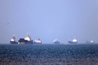 In this picture obtained from Iran's ISNA news agency on May 4, 2026, vessels are pictured anchored in the Strait of Hormuz off Bandar Abbas in southern Iran. Iran's Revolutionary Guards on May 4 denied that any commercial ships had crossed the Strait of Hormuz, after the US military earlier said two US-flagged merchant vessels had transited through the vital waterway. (Photo by Amirhossein KHORGOOEI / ISNA / AFP) / <!-- NICAID(16282112) -->