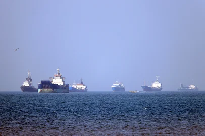 In this picture obtained from Iran's ISNA news agency on May 4, 2026, vessels are pictured anchored in the Strait of Hormuz off Bandar Abbas in southern Iran. Iran's Revolutionary Guards on May 4 denied that any commercial ships had crossed the Strait of Hormuz, after the US military earlier said two US-flagged merchant vessels had transited through the vital waterway. (Photo by Amirhossein KHORGOOEI / ISNA / AFP) / <!-- NICAID(16282112) -->