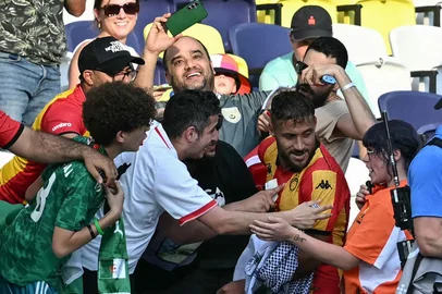 Esperance's Algerian midfielder #11 Youcef Belaili (R) celebrates with fans after scoring  his team's first goal during the FIFA Club World Cup 2025 Group D football match between US Los Angeles FC and Tunis' Esperance Sportive de Tunis at the Geodis Park stadium in Nashville on June 20, 2025. (Photo by Paul ELLIS / AFP)<!-- NICAID(16064484) -->