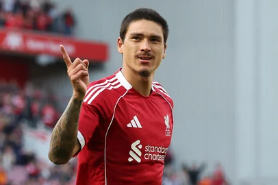 Liverpool's Uruguayan striker #09 Darwin Nunez celebrates scoring the team's second goal during the first of two pre season friendly football matches between Liverpool and Athletic Bilbao at Anfield in Liverpool, north west England on August 4, 2025. (Photo by Darren Staples / AFP)<!-- NICAID(16095335) -->