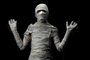 Studio shot portrait  of young man in costume  dressed as a halloween  cosplay of scary mummy pose like a frightened acting on isolated black background.Fonte: 228044206<!-- NICAID(15485623) -->