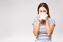 *A PEDIDO DE LUISA TESSUTO* People, healthcare, rhinitis, cold and allergy concept - unhappy woman with paper napkin blowing nose - Foto: denis_vermenko/stock.adobe.comFonte: 212764488<!-- NICAID(15273402) -->
