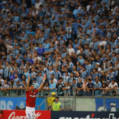 Huachipato's midfielder Felipe Loyola celebrates after scoring during the Copa Libertadores group stage first leg football match between Brazil's Gremio and Chile's Huachipato at the Arena do Gremio Stadium in Porto Alegre, Brazil, on April 9, 2024. (Photo by SILVIO AVILA / AFP)<!-- NICAID(15730303) -->
