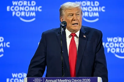 US President Donald Trump delivers a special address during the World Economic Forum (WEF) annual meeting in Davos on January 21, 2026. The World Economic Forum takes place in Davos from January 19 to January 23, 2026. (Photo by Fabrice COFFRINI / AFP)<!-- NICAID(16208084) -->