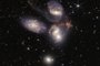 This image released by NASA on July 12, 2022, shows Stephans Quintet captured by the James Webb Space Telescope (JWST), a visual grouping of five galaxies, in a new light. This enormous mosaic is JWSTs largest image to date, covering about one-fifth of the Moons diameter. It contains over 150 million pixels and is constructed from almost 1,000 separate image files. - The JWST is the most powerful telescope launched into space and it reached its final orbit around the sun, approximately 930,000 miles from Earths orbit, in January, 2022. The technological improvements of the JWST and distance from the sun will allow scientists to see much deeper into our universe with greater detail. (Photo by Handout / NASA / AFP) / RESTRICTED TO EDITORIAL USE - MANDATORY CREDIT "AFP PHOTO / NASA" - NO MARKETING NO ADVERTISING CAMPAIGNS - DISTRIBUTED AS A SERVICE TO CLIENTSEditoria: SCILocal: WashingtonIndexador: HANDOUTSecao: space programmeFonte: NASAFotógrafo: Handout<!-- NICAID(15146840) -->