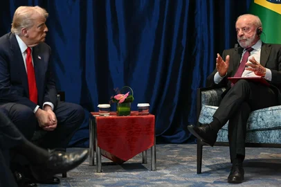 Brazil's President Luiz Inacio Lula da Silva (R) talks to US President Donald Trump during a bilateral meeting on the sidelines of the 47th Association of Southeast Asian Nations (ASEAN) Summit in Kuala Lumpur on October 26, 2025. (Photo by ANDREW CABALLERO-REYNOLDS / AFP)<!-- NICAID(16154136) -->