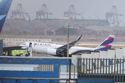 This grab from an AFP video shows the LA2213 flight plane after it collided with a firefighting vehicle at the Jorge Chavez International Ariport in Lima, on November 18, 2022. - Two firefighters died this Friday after their vehicle collided with a Latam airline plane that was taking off from the Lima airport for a domestic flight, an incident that the Peruvian prosecutor's office will investigate "for possible crimes of homicide and injuries." (Photo by Christian SIERRA / AFPTV / AFP)<!-- NICAID(15269929) -->
