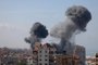 Smoke billows from a residential building following an Israeli airstrike in Gaza City on October 7, 2023. Barrages of rockets were fired at Israel from the Gaza Strip at dawn as militants from the blockaded Palestinian enclave infiltrated Israel, with at least one person killed, the army and medics said. (Photo by MOHAMMED ABED / AFP)<!-- NICAID(15562971) -->