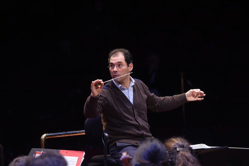 (FILES) This file photograph taken on March 4, 2016, shows Russian conductor Tugan Sokhiev rehearsing with the Orchestre national du Capitole of Toulouse at the Halle aux Grains venue in Toulouse, south-western France. - The Bolshoi Theatre's music director and principal conductor Tugan Sokhiev announced his resignation on March 6, 2022, saying he felt under pressure due to calls to take a position on the Ukraine conflict. (Photo by ERIC CABANIS / AFP)<!-- NICAID(15034613) -->