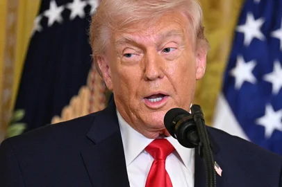 US President Donald Trump speaks during a Women's History Month event in the East Room of the White House in Washington, DC, on March 12, 2026. (Photo by Jim WATSON / AFP)Editoria: POLLocal: WashingtonIndexador: JIM WATSONSecao: politics (general)Fonte: AFPFotógrafo: STF<!-- NICAID(16244413) -->