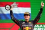 Red Bull Racing's Dutch driver Max Verstappen holds the winner's trophy on the podium of the Dutch Formula One Grand Prix at the Zandvoort circuit on September 4, 2022. (Photo by Kenzo TRIBOUILLARD / AFP)<!-- NICAID(15196680) -->