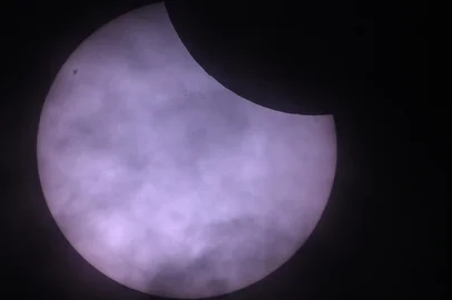 The moon passes in front of the sun during a partial solar eclipse, seen from Berlin, Germany, on March 29, 2025. Skygazers across a broad swathe of the Northern Hemisphere have a chance to see the Moon take a bite out of the Sun when a partial solar eclipse sweeps from eastern Canada to Siberia. Eclipses occur when the Sun, Moon and Earth all line up. When they perfectly align for a total solar eclipse, the Moon fully blots out the Sun's disc, creating an eerie twilight here on Earth. (Photo by RALF HIRSCHBERGER / AFP)<!-- NICAID(16006067) -->