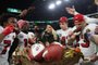 SEATTLE, WASHINGTON - NOVEMBER 23: Christian McCaffrey #23 of the San Francisco 49ers and Charvarius Ward #7 of the San Francisco 49ers eat a turkey leg during the post game interview after beating the Seattle Seahawks 31-13 at Lumen Field on November 23, 2023 in Seattle, Washington.   Steph Chambers/Getty Images/AFP (Photo by Steph Chambers / GETTY IMAGES NORTH AMERICA / Getty Images via AFP)<!-- NICAID(15607887) -->