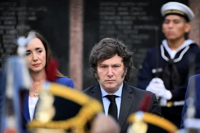 Argentina's President Javier Milei (C) and his vice president Victoria Villaruel (L) take part in a ceremony to commemorate the 42nd anniversary of the war between Argentina and the United Kingdom over the Malvinas/Falkland islands, at the Cenotaph to the Fallen of the Malvinas War in Buenos Aires, on April 2, 2024. (Photo by Luis ROBAYO / AFP)<!-- NICAID(15723301) -->