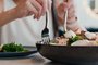 Woman enjoy the salad in restaurant