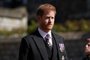 Britain's Prince Harry, Duke of Sussex walks during the funeral procession of Britain's Prince Philip, Duke of Edinburgh to St George's Chapel in Windsor Castle in Windsor, west of London, on April 17, 2021. - Philip, who was married to Queen Elizabeth II for 73 years, died on April 9 aged 99 just weeks after a month-long stay in hospital for treatment to a heart condition and an infection. (Photo by Victoria Jones / POOL / AFP)<!-- NICAID(14760454) -->