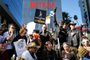 LOS ANGELES, CALIFORNIA - NOVEMBER 08: SAG-AFTRA members pose for a group photo, during a 'Post Apocalyptic' themed picket outside Netflix studios, on day 118 of their strike against the Hollywood studios, on November 8, 2023 in Los Angeles, California. A tentative labor agreement has been reached between the actors union and the Alliance of Motion Picture and Television Producers (AMPTP) with the strike set to end after midnight.   Mario Tama/Getty Images/AFP (Photo by MARIO TAMA / GETTY IMAGES NORTH AMERICA / Getty Images via AFP)<!-- NICAID(15592117) -->
