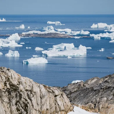 (FILES) In this file photo taken on August 15, 2019 an aerial photo taken on August 15, 2019 shows icebergs as they float along the eastern cost of Greenland near Kulusuk (aslo spelled Qulusuk). - Rising global temperature, rising sea levels, intensification of extreme events... The publication of the report of the Intergovernmental Panel on Climate Change (IPCC) is scheduled on August 9. (Photo by Jonathan NACKSTRAND / AFP)<!-- NICAID(14857780) -->
